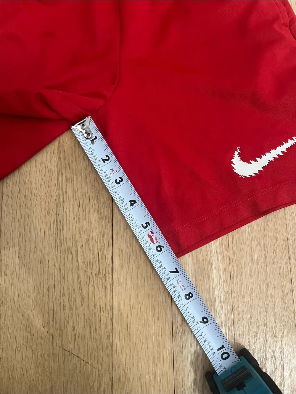 Nike Red Athletic Shorts with White Swoosh